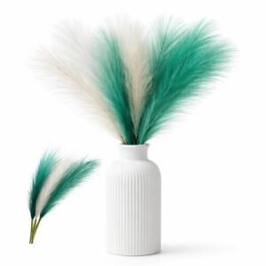 Artificial pampas grass stems in green and white mixed colors arranged in a small vase for wedding and home decor